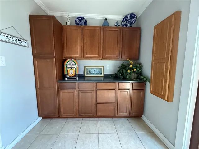 a dining room with furniture a chandelier and wooden floor