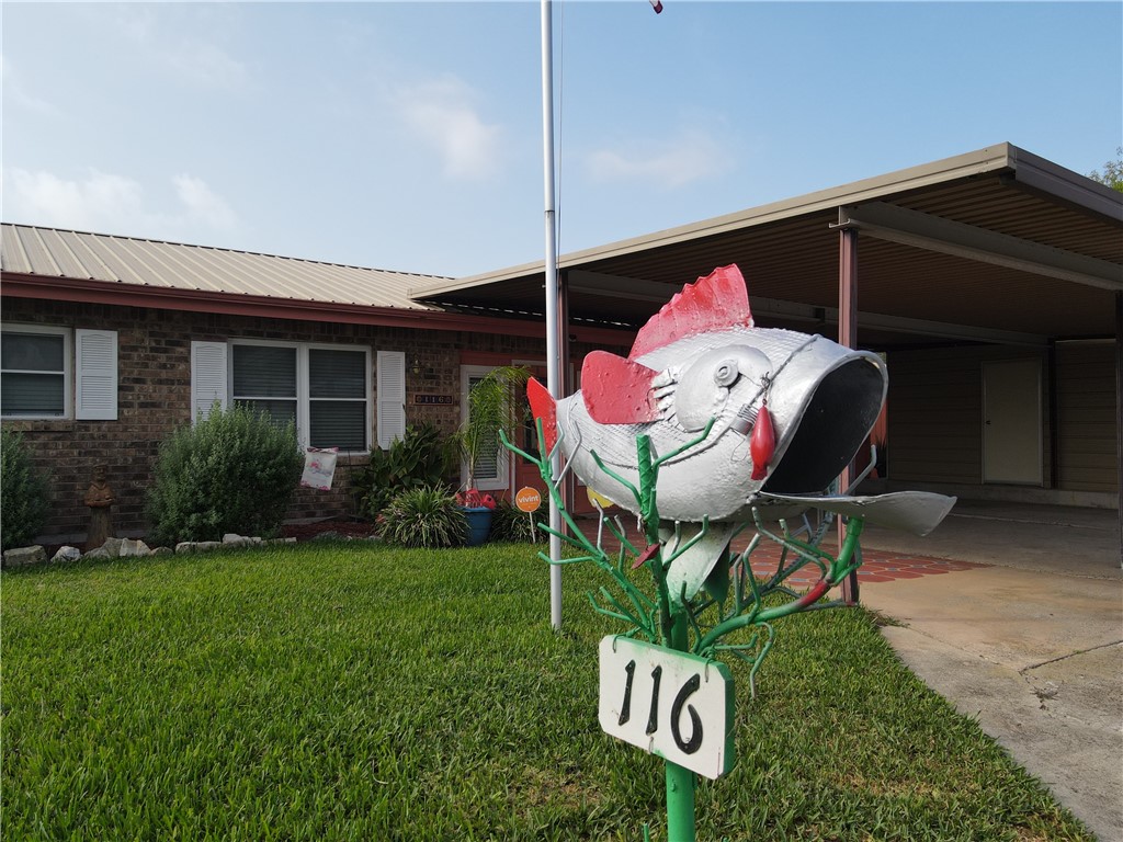 116 Sunset Drive Mathis, TX 78368 - Photo 2 of 40 a front view of a house with garden
