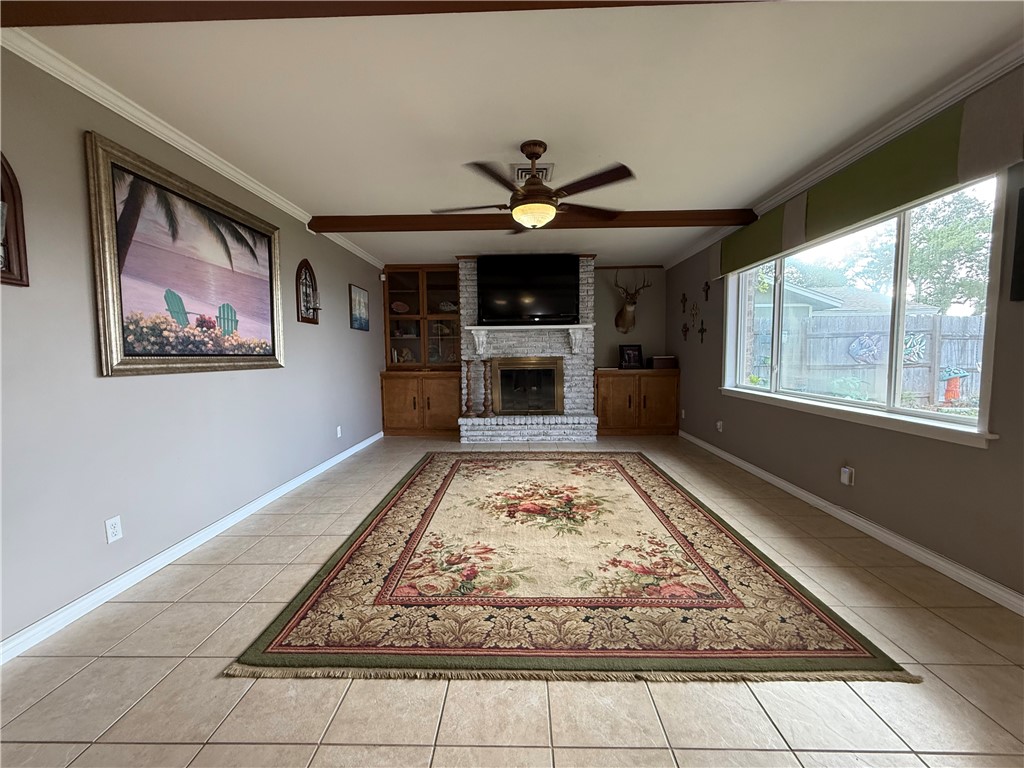 116 Sunset Drive Mathis, TX 78368 - Photo 23 of 40 a living room with fireplace and a rug