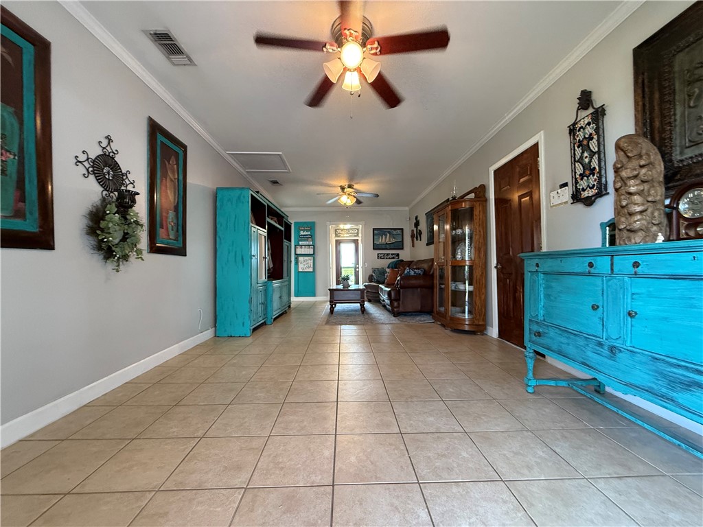 116 Sunset Drive Mathis, TX 78368 - Photo 9 of 40 a view of a livingroom with furniture and a ceiling fan