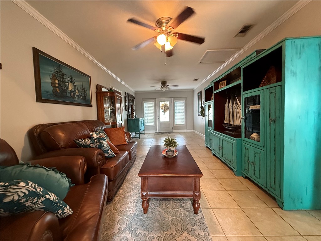 116 Sunset Drive Mathis, TX 78368 - Photo 10 of 40 a living room with furniture and a flat screen tv