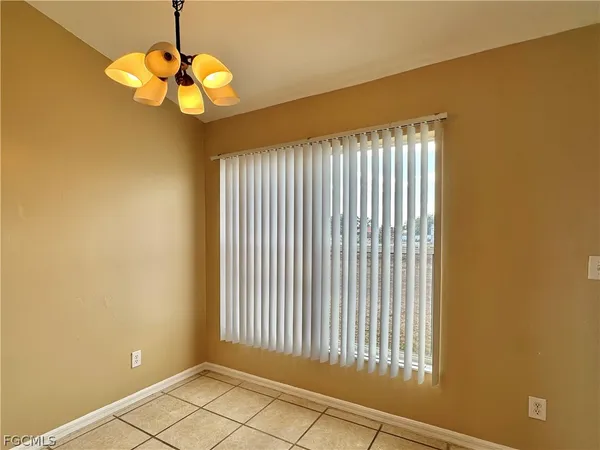 a view of a livingroom with a chandelier fan