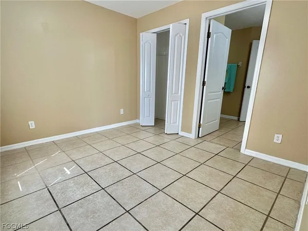 a bathroom with a double vanity sink and mirror