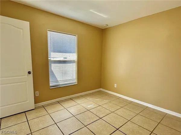 a white toilet sitting next to a bathroom sink and a tub