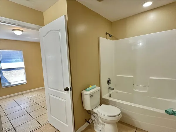 a bathroom with a toilet and a bathtub