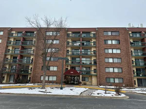 a front view of building with street view