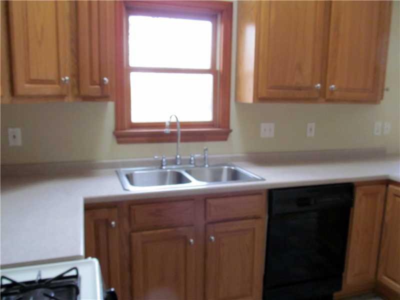 Kitchen. Light and bright kitchen, stainless steel double bowl sink, gas range.