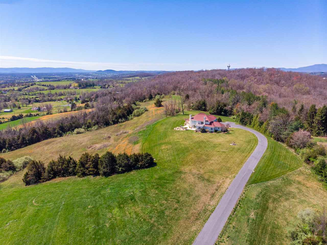 238 Fort Defiance Road Fort Defiance, VA 24437 - Photo 12 of 50 a view of a lush green forest with mountains and a houses