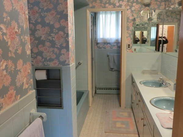 197 Gardner Road Brookline, MA 02445 - Photo 18 of 30 a bathroom with a granite countertop sink a toilet and shower