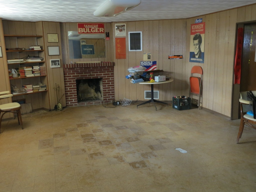 197 Gardner Road Brookline, MA 02445 - Photo 23 of 30 a living room with furniture and a fireplace