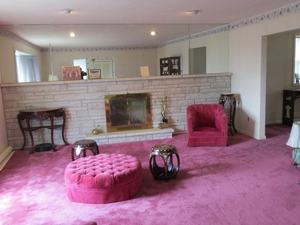 197 Gardner Road Brookline, MA 02445 - Photo 9 of 30 a living room with furniture and a fireplace