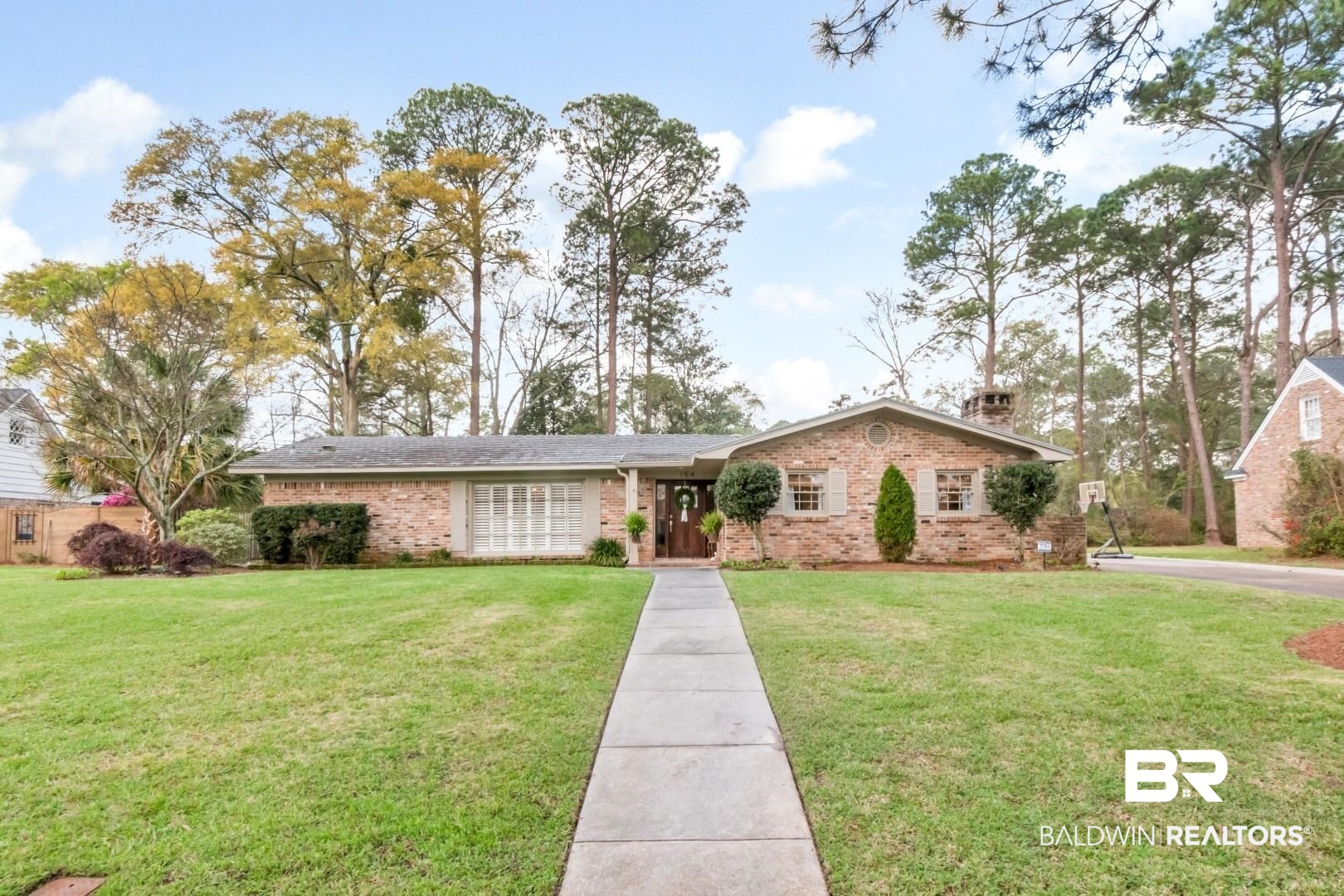154 Fenwick Road Mobile, AL 36608 - Photo 44 of 48 Ranch-style home with a front lawn, brick siding, and a chimney