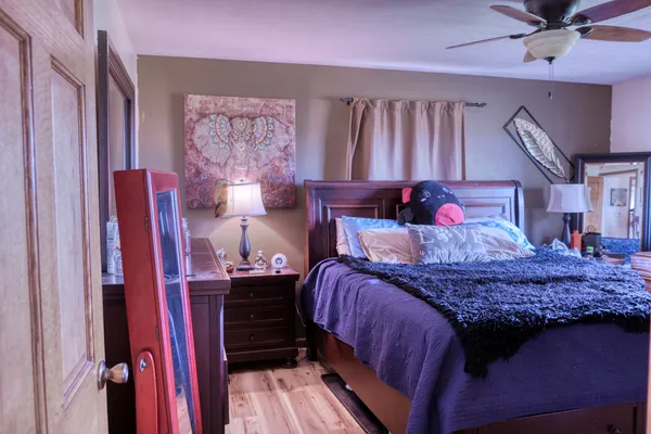 a bed room with a bed and a window