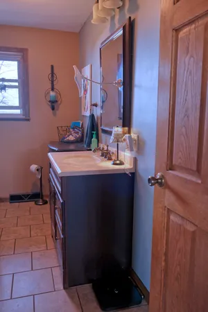 a bathroom with a sink and a mirror