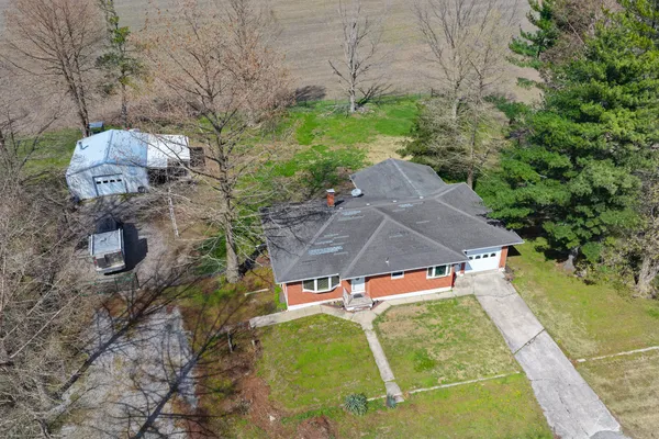 an aerial view of a house with outdoor space