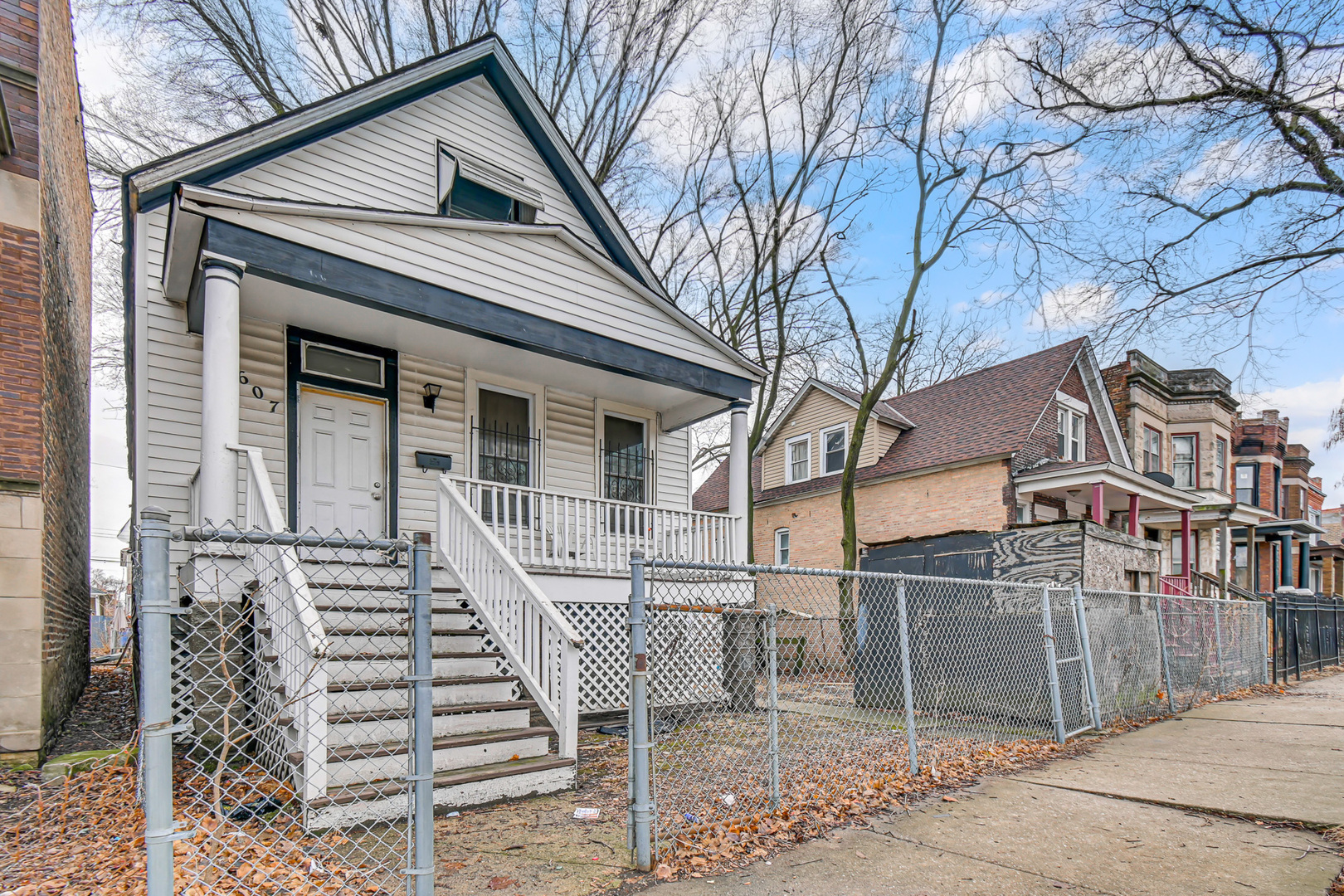 5607 South Laflin Street Chicago, IL 60636 - Photo 3 of 17 front view of a house with a large tree