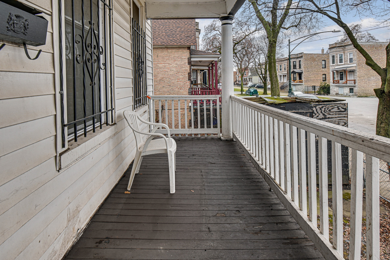 5607 South Laflin Street Chicago, IL 60636 - Photo 5 of 17 a view of a house with wooden deck