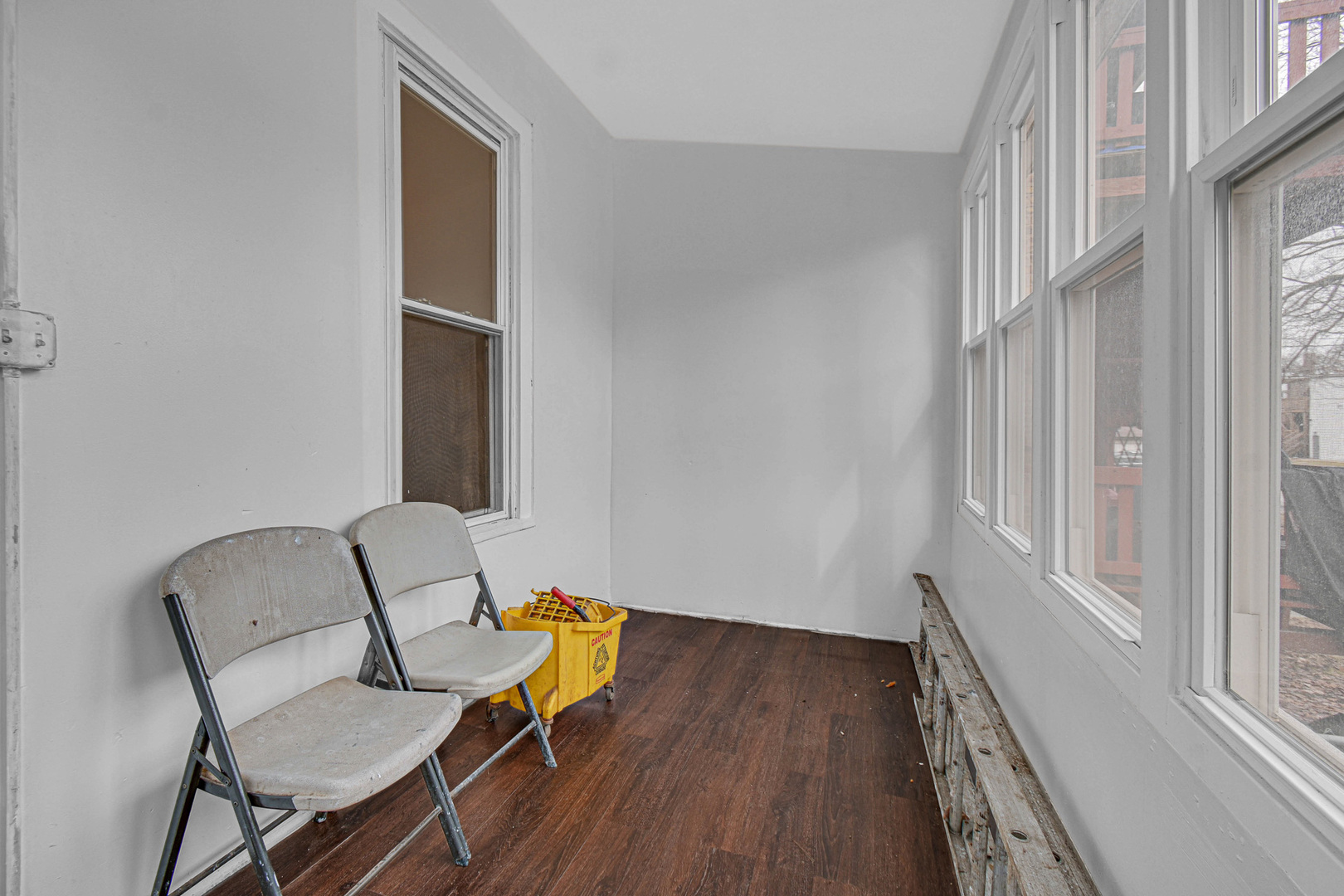 5607 South Laflin Street Chicago, IL 60636 - Photo 6 of 17 a view of a room with furniture and wooden floor