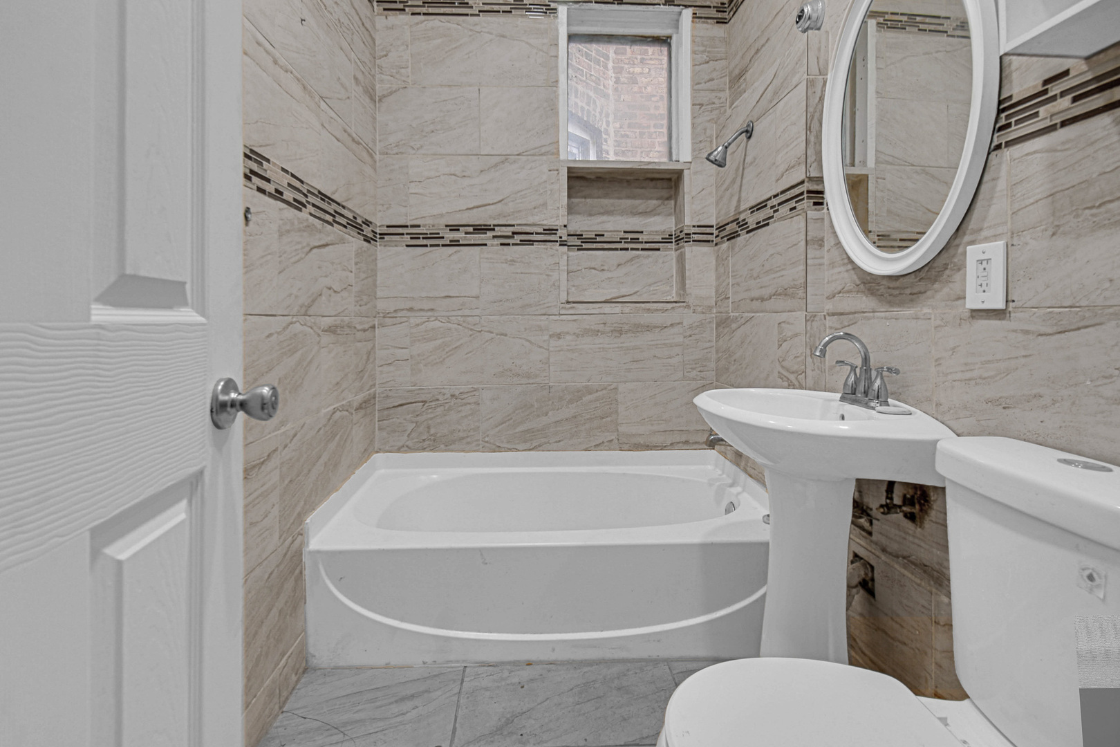 5607 South Laflin Street Chicago, IL 60636 - Photo 10 of 17 a white bath tub sitting next to a white sink and vanity