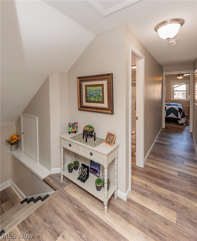 120 Sunset Road Avon Lake, OH 44012 - Photo 23 of 40 Hallway with vaulted ceiling and hardwood / wood-style floors