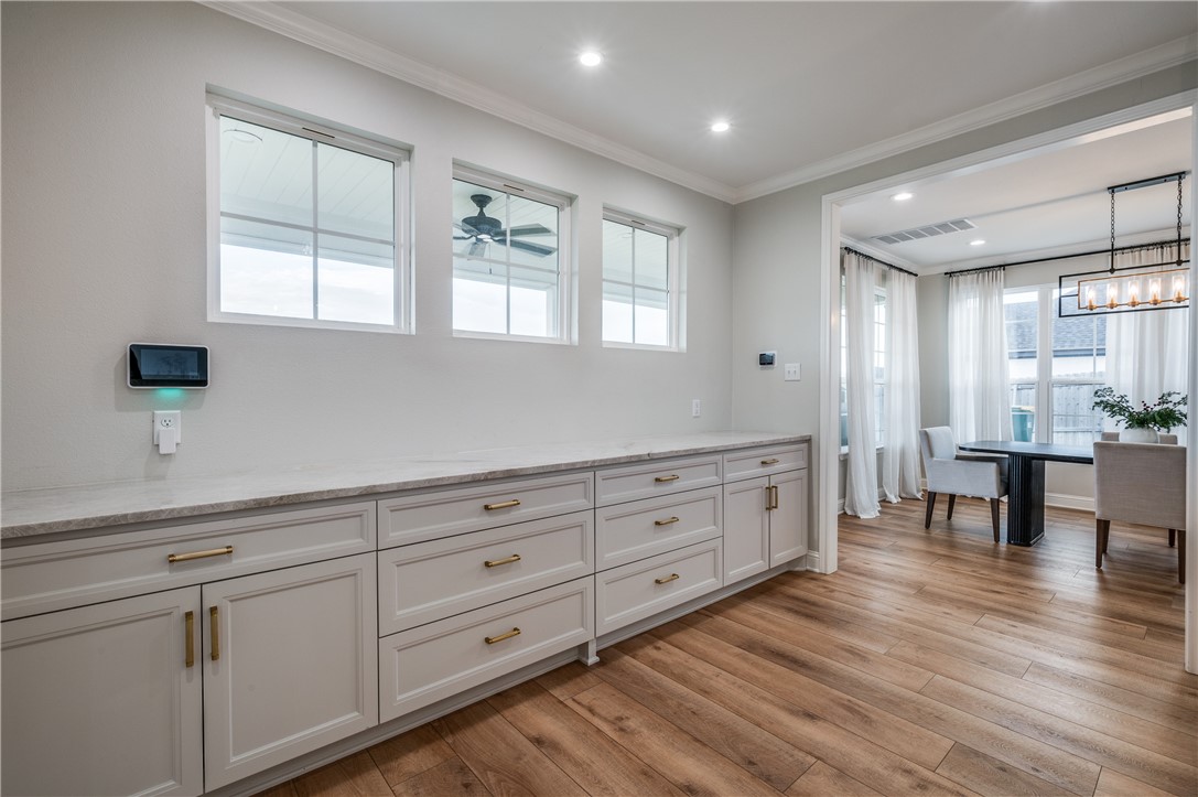 164 Water View Lane Robinson, TX 76706 - Photo 12 of 26 a spacious bathroom with double vanity a ceiling fan and windows