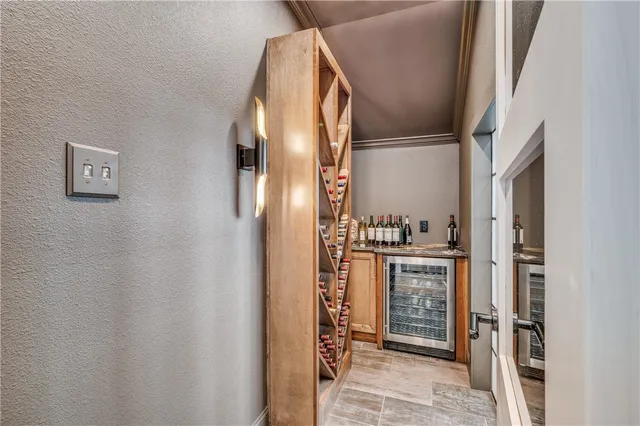 a kitchen with stainless steel appliances granite countertop a refrigerator and a stove