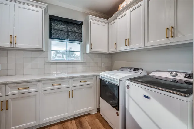 a view of white cabinets and sink