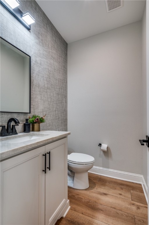 164 Water View Lane Robinson, TX 76706 - Photo 3 of 26 a bathroom with a sink a toilet a mirror and vanity