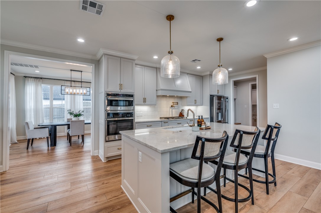 164 Water View Lane Robinson, TX 76706 - Photo 8 of 26 a view of a dining room and livingroom with furniture wooden floor kitchen chandelier