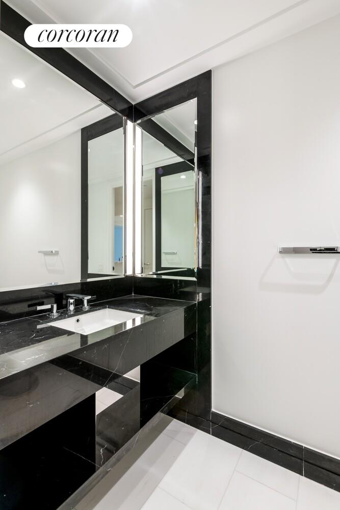 10 Riverside Boulevard, Unit 27C Manhattan, NY 10069 - Photo 10 of 14 a bathroom with a sink and a mirror