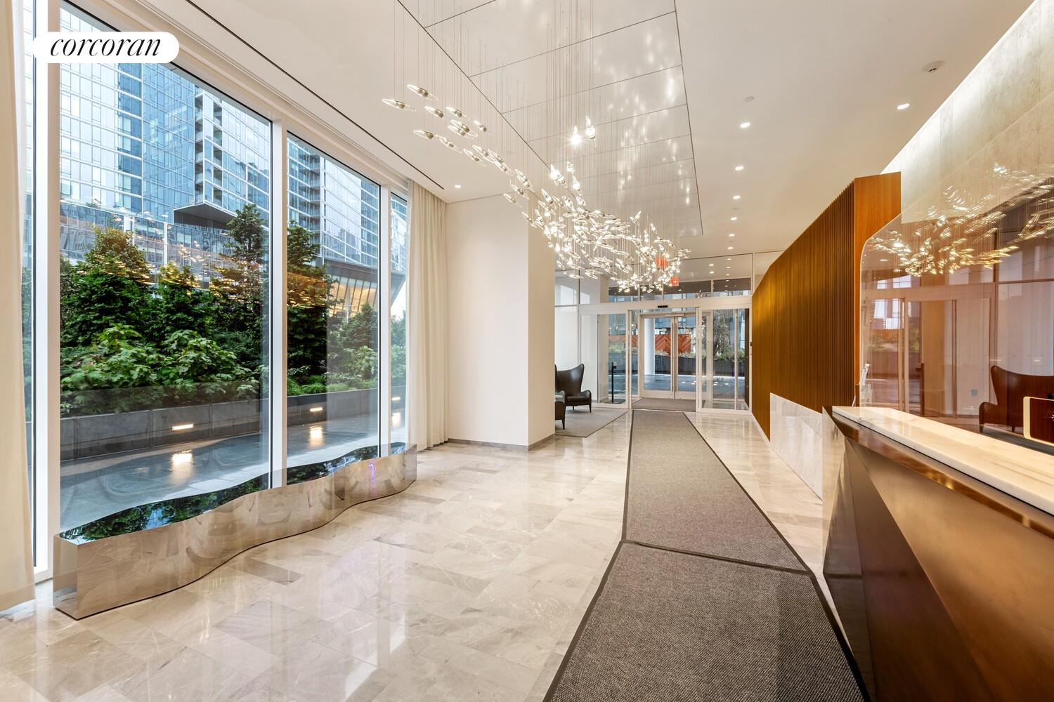 10 Riverside Boulevard, Unit 27C Manhattan, NY 10069 - Photo 11 of 14 a view of a lobby with black carpet