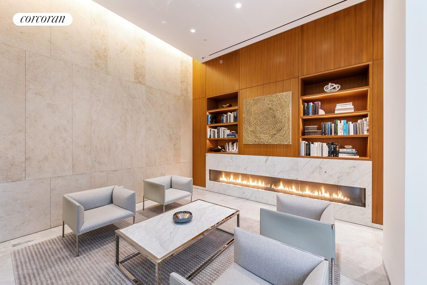 10 Riverside Boulevard, Unit 27C Manhattan, NY 10069 - Photo 12 of 14 a living room with furniture and a book shelf