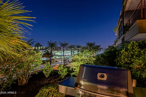 a kitchen that has a sink a stove and a refrigerator
