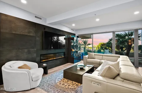 a kitchen with a table chairs sink and microwave