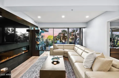 a dining room with wooden floor and entryway