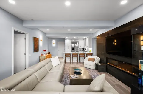 a bathroom with a granite countertop sink mirror and toilet
