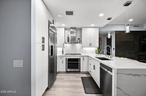a view of a room with wooden floor