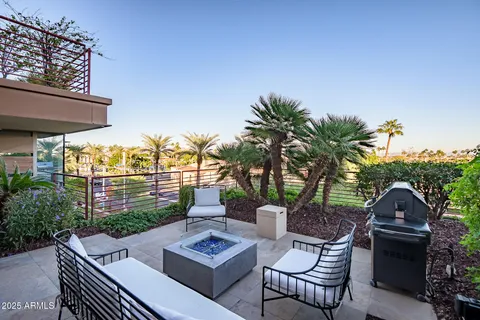 a view of a chairs and table in patio