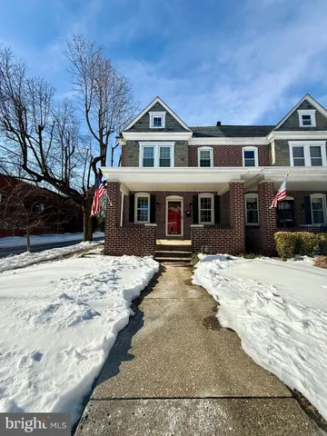 a front view of a building with a yard