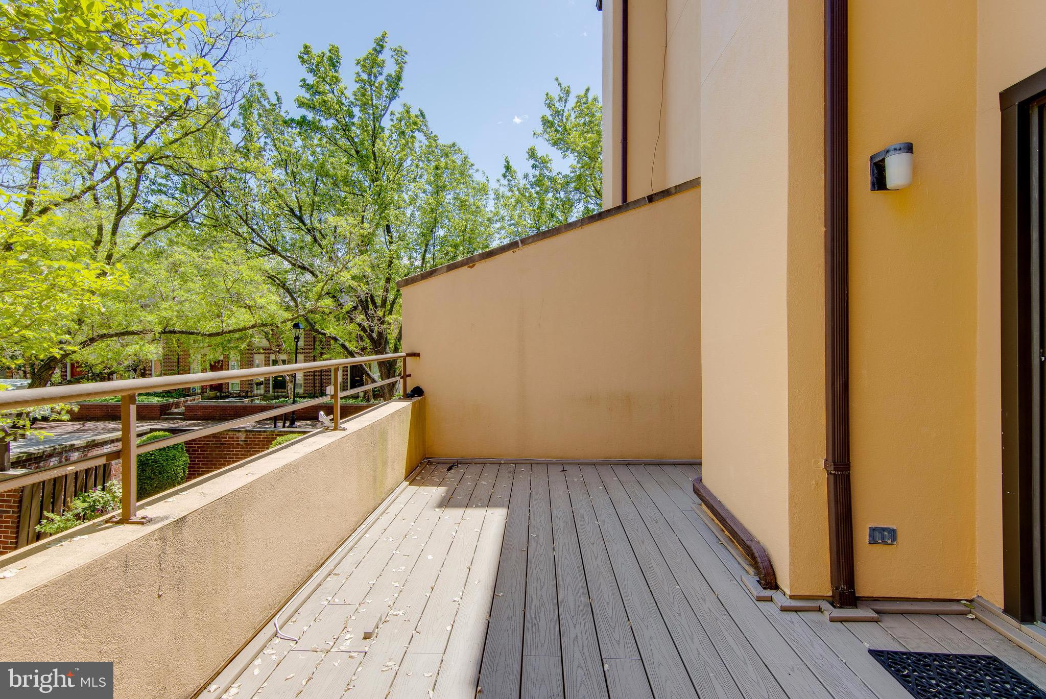627 South Hanover Street Baltimore, MD 21230 - Photo 11 of 41 a view of balcony with wooden floor and potted plant