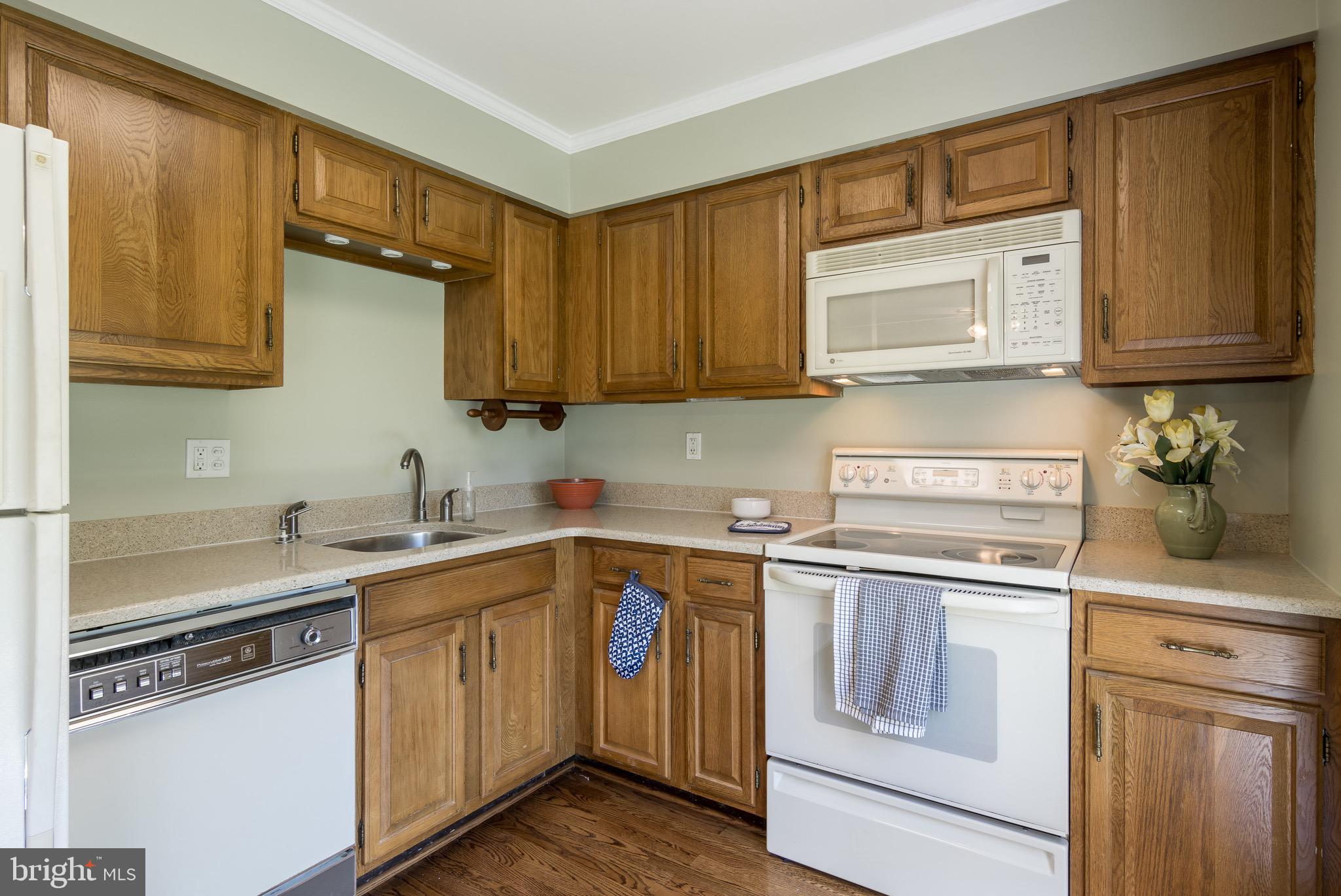 627 South Hanover Street Baltimore, MD 21230 - Photo 15 of 41 a kitchen with a sink stove and cabinets
