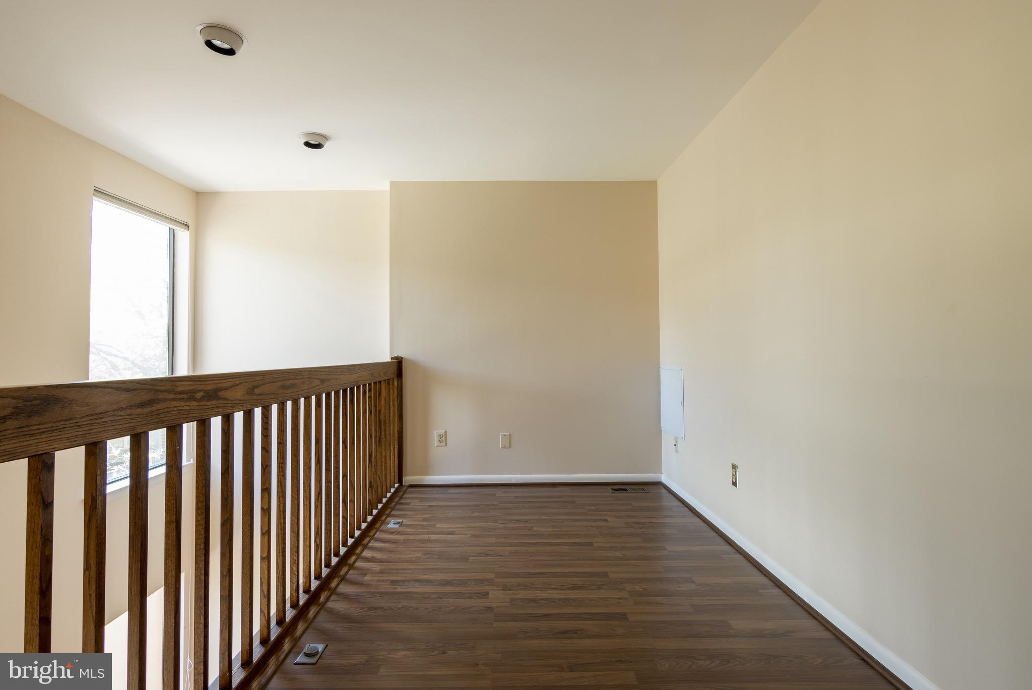 627 South Hanover Street Baltimore, MD 21230 - Photo 18 of 41 a view of a hallway with wooden floor