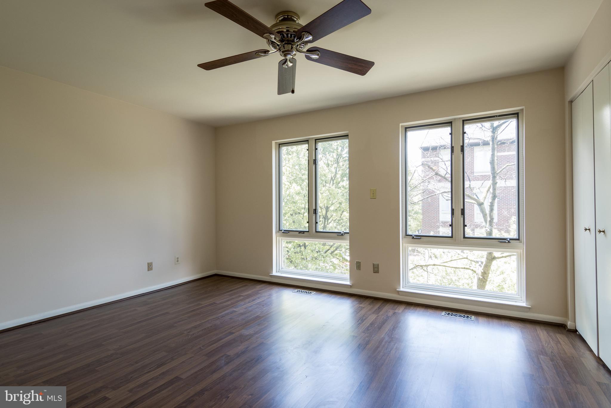 627 South Hanover Street Baltimore, MD 21230 - Photo 20 of 41 a view of an empty room with wooden floor and a window