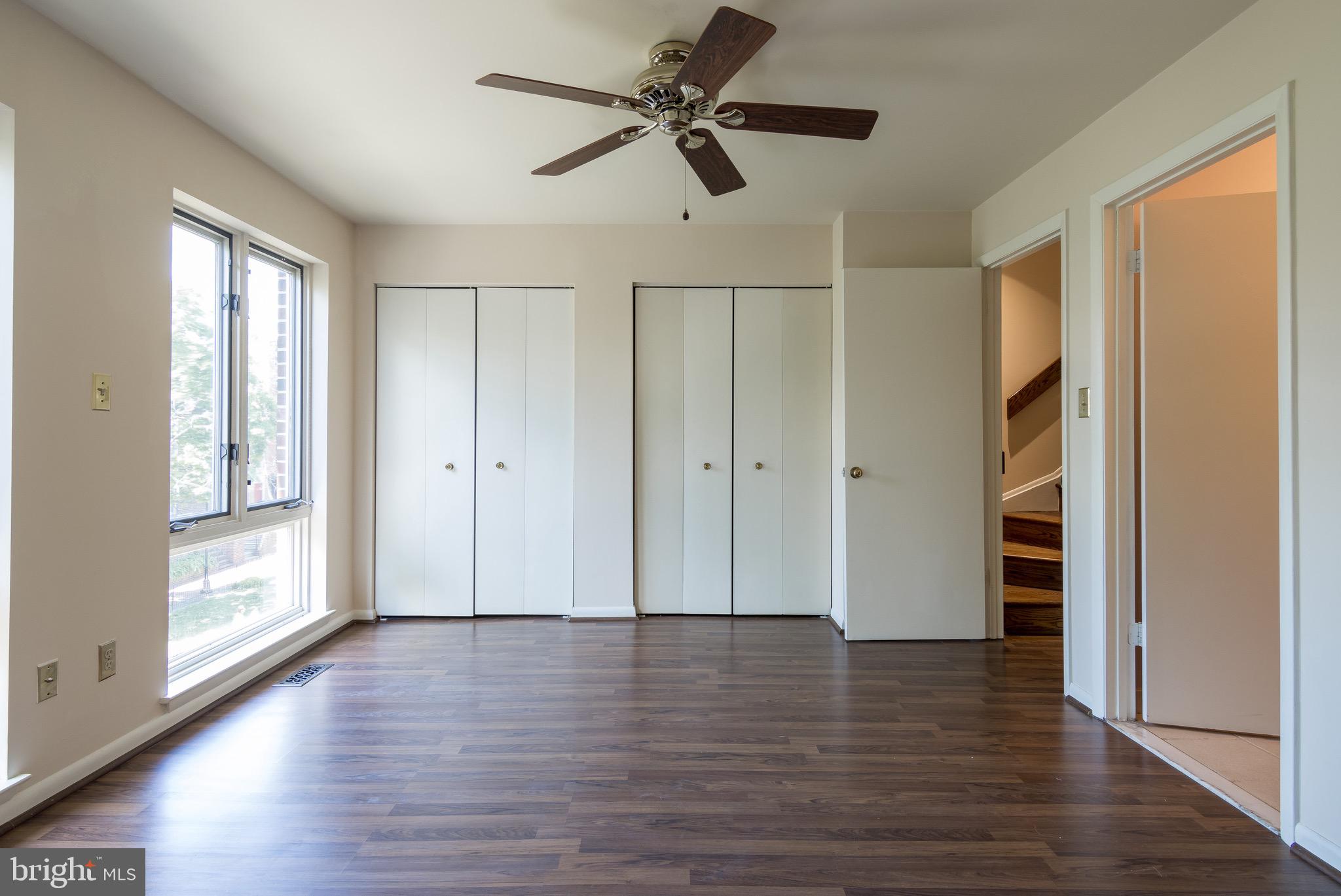 627 South Hanover Street Baltimore, MD 21230 - Photo 21 of 41 an empty room with wooden floor closet and windows