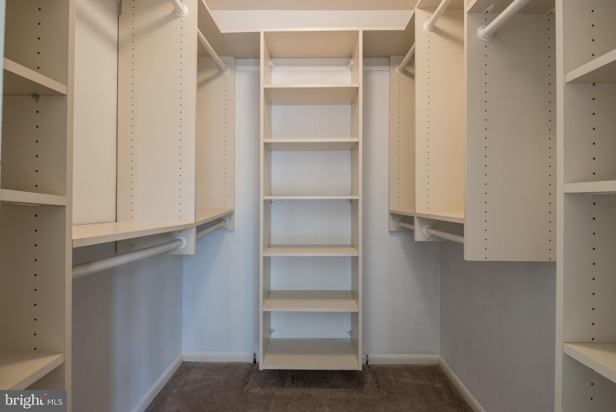 627 South Hanover Street Baltimore, MD 21230 - Photo 28 of 41 a view of walk in closet with empty racks