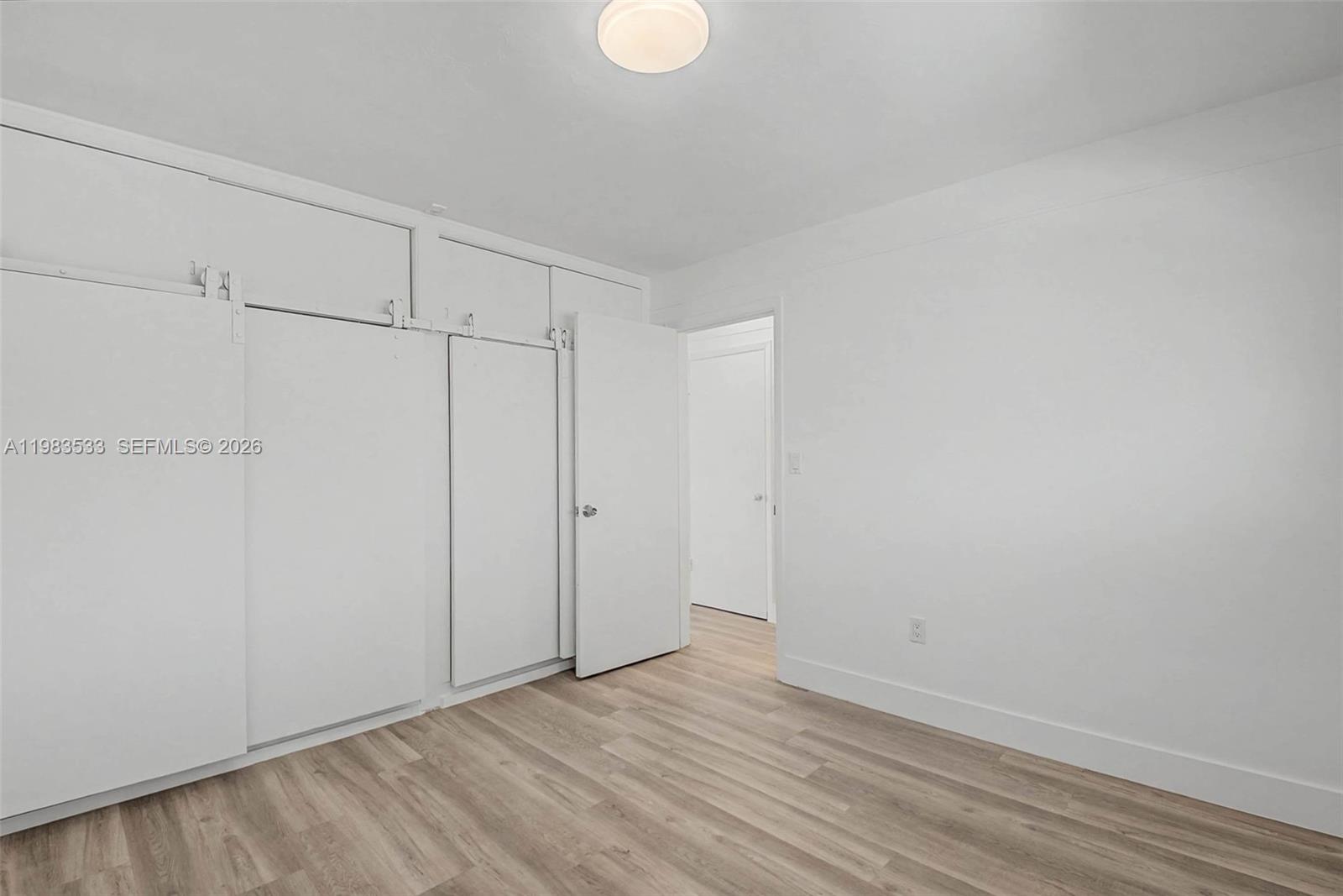 60 Northwest 79th Street, Unit 10 Miami, FL 33150 - Photo 8 of 18 a view of an empty room