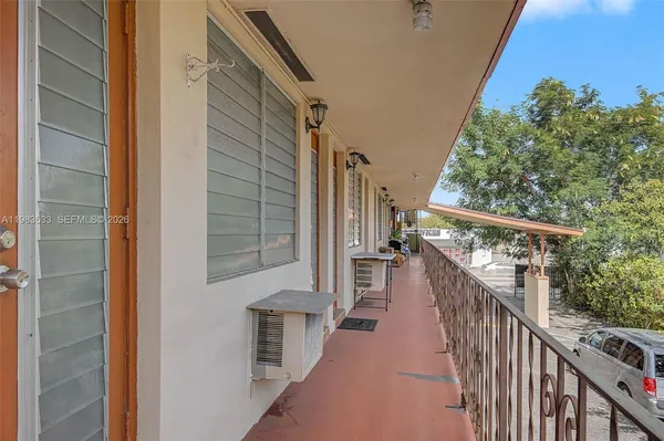 a view of a balcony with wooden floor and stairs