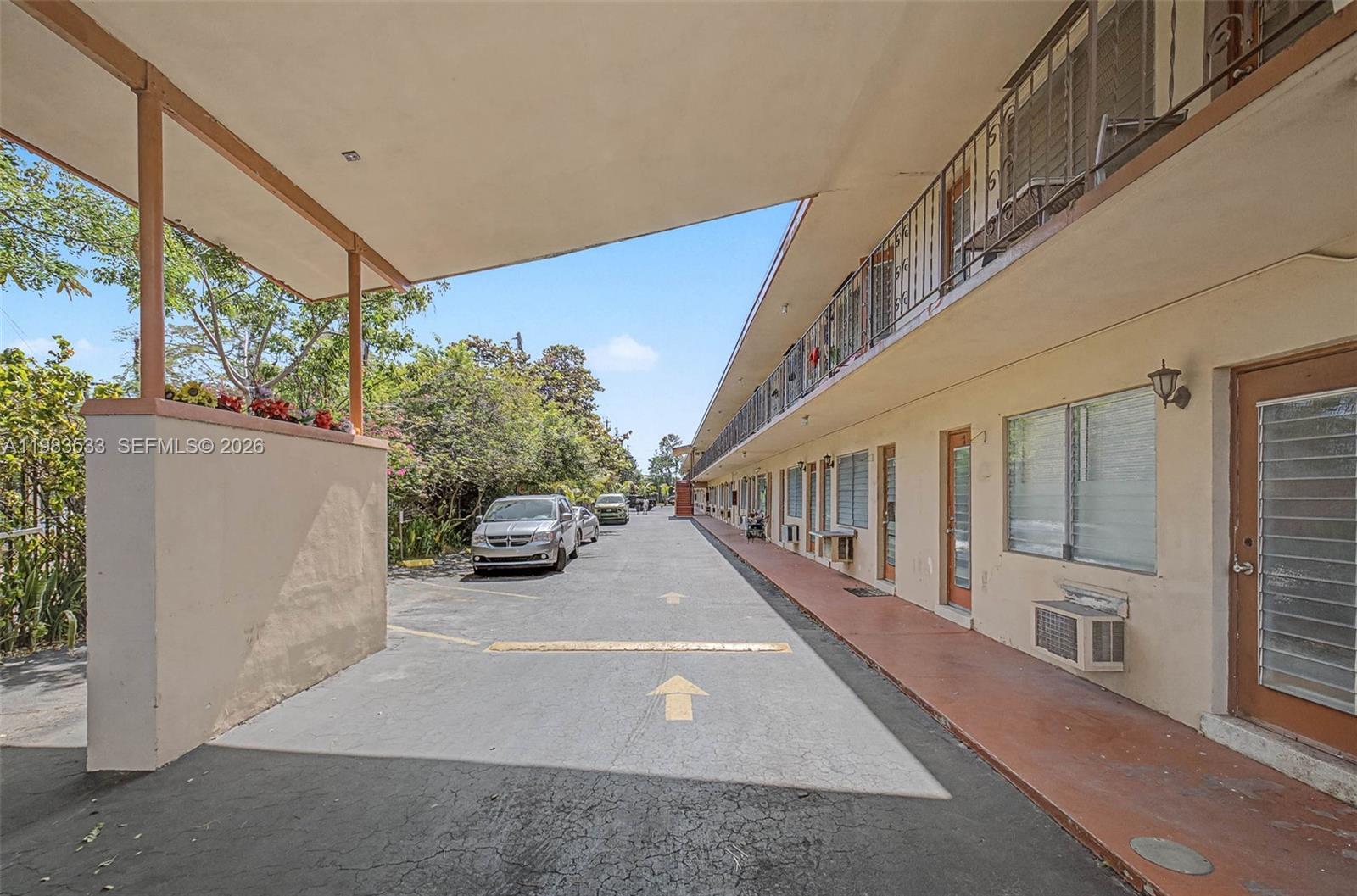 60 Northwest 79th Street, Unit 10 Miami, FL 33150 - Photo 10 of 18 a view of a house with a patio