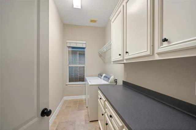a bedroom with a bed flat screen tv and window