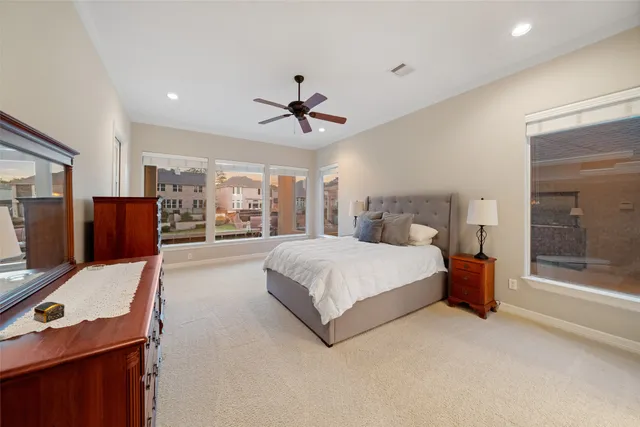 a spacious bathroom with a bathtub shower sink double and mirror